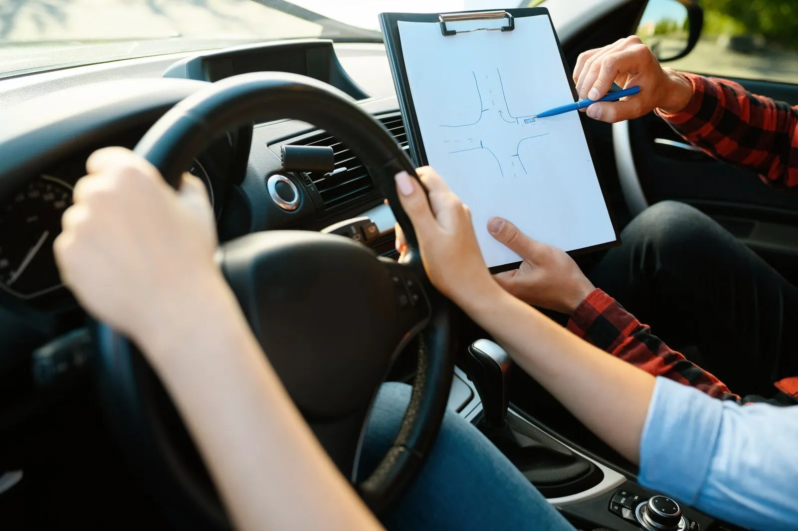 Learner driver at the wheel during a driving lesson